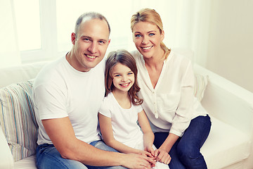 Image showing happy parents with little daughter at home