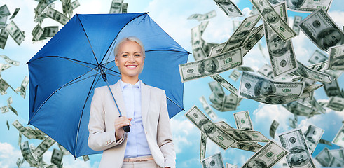 Image showing happy young businesswoman with umbrella outdoors