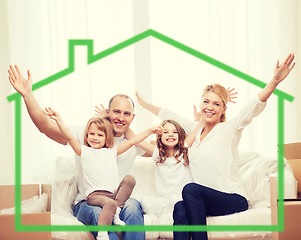 Image showing smiling parents and two little girls at new home