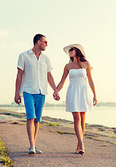 Image showing smiling couple walking outdoors