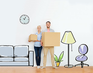 Image showing couple with cardboard boxes moving to new home