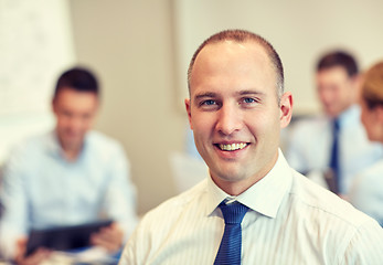 Image showing group of smiling businesspeople meeting in office