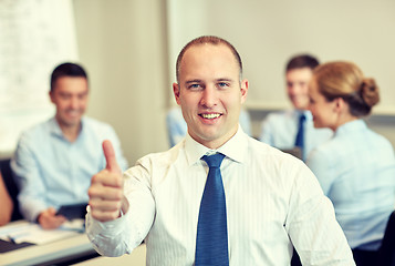 Image showing group of smiling businesspeople meeting in office