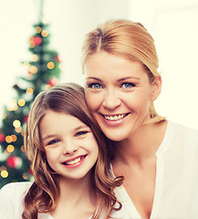 Image showing smiling mother and little girl