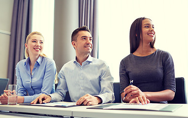 Image showing smiling business people meeting in office