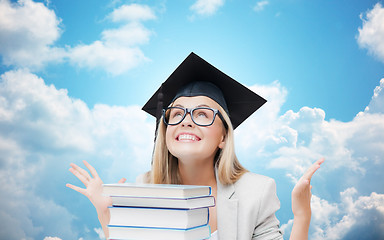 Image showing happy student girl in bachelor cap with books