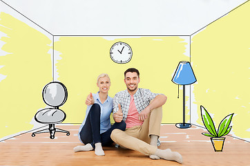 Image showing happy couple showing thumbs up at new home