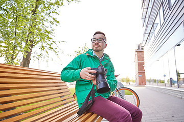 Image showing young hipster man with digital camera in city