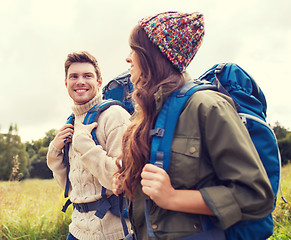 Image showing smiling couple with backpacks hiking