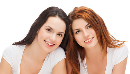 Image showing two laughing girls in white t-shirts