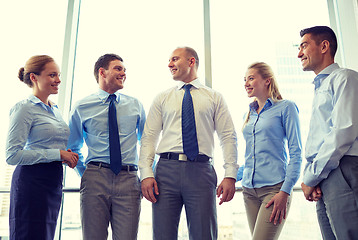 Image showing smiling businesspeople meeting in office