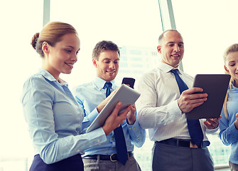 Image showing business people with tablet pc and smartphones