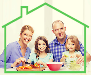 Image showing happy family with two kids making dinner at home