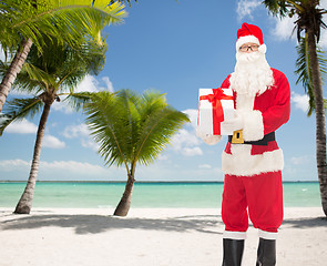 Image showing man in costume of santa claus with gift box