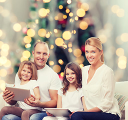 Image showing happy family with tablet pc computers