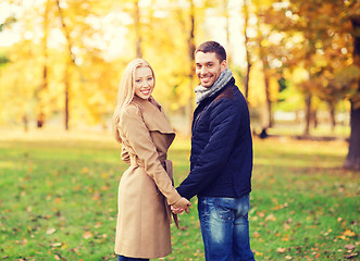 Image showing smiling couple in autumn park