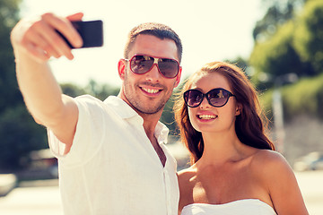 Image showing smiling couple in city