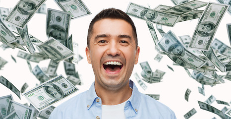 Image showing laughing man with falling dollar money