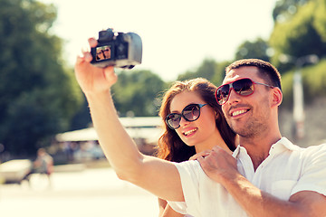 Image showing smiling couple in city