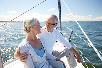 Image showing senior couple hugging on sail boat or yacht in sea