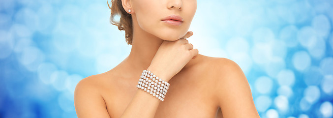 Image showing beautiful woman with pearl bracelet and earrings