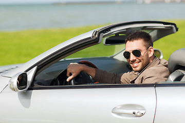 Image showing happy man driving cabriolet car outdoors