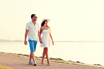 Image showing smiling couple walking outdoors