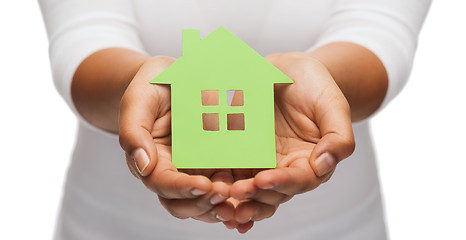 Image showing woman hands holding green house