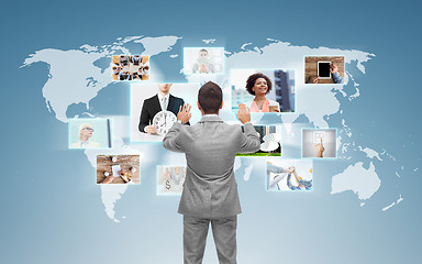 Image showing businessman working with virtual screen