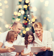 Image showing happy family with tablet pc computers