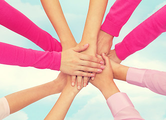 Image showing close up of women with hands on top