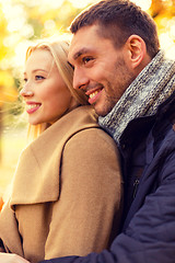 Image showing smiling couple hugging in autumn park