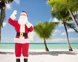 Image showing man in costume of santa claus with bag