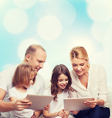 Image showing happy family with tablet pc computers