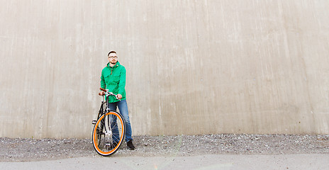 Image showing happy young hipster man with fixed gear bike