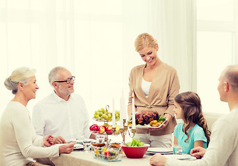 Image showing smiling family having holiday dinner at home