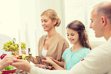 Image showing smiling family having holiday dinner at home