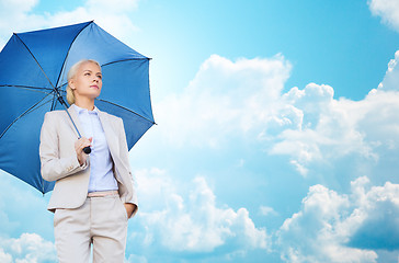 Image showing young smiling businesswoman with umbrella outdoors