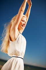 Image showing beautiful woman enjoying summer outdoors