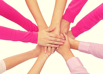 Image showing close up of women with hands on top