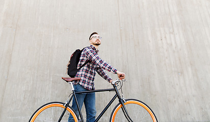 Image showing hipster man with fixed gear bike and backpack