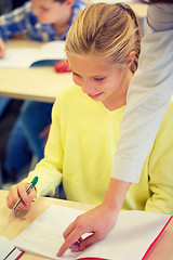 Image showing group of school kids writing test in classroom