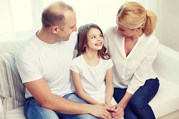 Image showing happy parents with little daughter at home