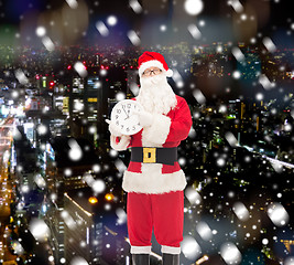 Image showing man in costume of santa claus with clock