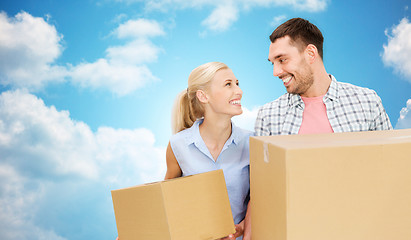 Image showing couple with cardboard boxes moving to new home