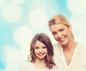 Image showing smiling mother and little girl