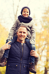 Image showing happy family having fun in autumn park