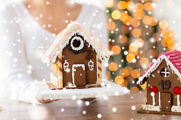 Image showing close up of woman showing gingerbread house