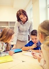 Image showing group of school kids writing test in classroom