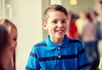 Image showing group of smiling school kids in corridor